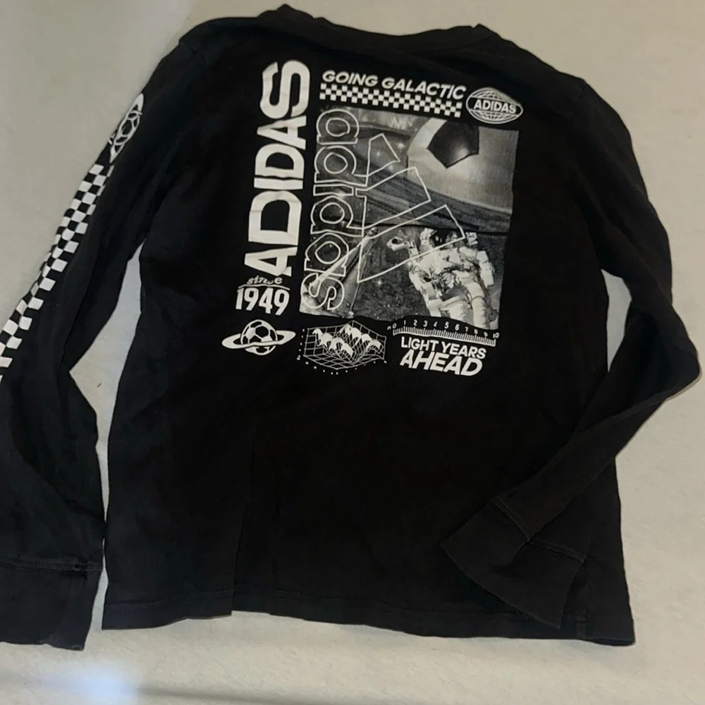 Kids Size 10-12 Adidas Black Long Sleeve Tee with Sleeve Graphics.